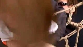 Slutty red panties and cock in handjob threesome with the woman on her knees and bound