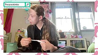 Webcam strip with a kitten, cross dressing show