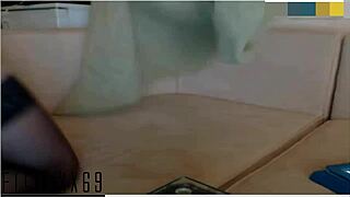 A beautiful redhead indulges in solo pleasure on camera