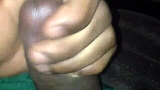 In this scene, a big black cock delivers a huge cumshot, covering everything with handjob assistance.