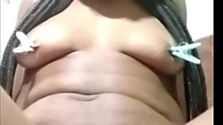 Self-clamping action with Cyndy Blackslave in intense BDSM