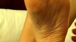 wb coworker engages in high arch rubbing during a casual office moment