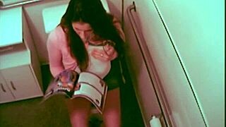 hot babe fingering her pussy while reading