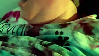 Dirty talking wife smoking cigarette in kinky bedroom scene