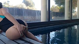 This slutty amateur fingers her pussy doggystyle bent over near the window.