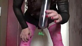 Crossdressing gay Mark Wright pissing and swallowing cock