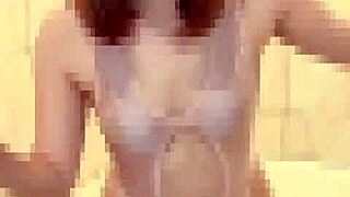 A Handsome Man in an Unusual Swimsuit Near the Glass