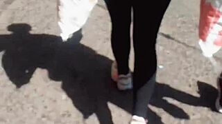 Milf shows off her rich ass on the street