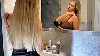 The amateur masturbates to orgasm with shaved pussy in close-up