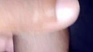 In a homemade setting, amateurs explore personal boundaries through intimate hand gestures.