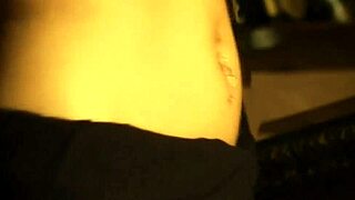 i's a beautiful nude indian brunette chick from bollywood undressing erotically with clothes ripped