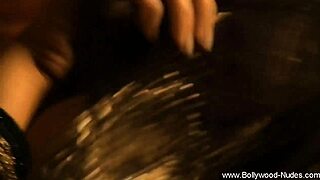 i's a beautiful nude indian brunette chick from bollywood undressing erotically with clothes ripped