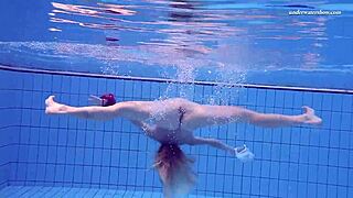 Russian babe Elena Proklova swims naked in clear underwater scene with stunning body