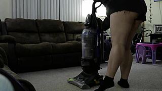 Chubby woman cleans the house while wearing shorts.