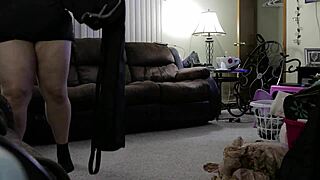 Chubby woman cleans the house while wearing shorts.