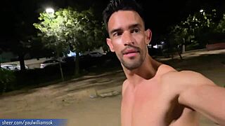 this tall muscular tattooed guy walks naked barefoot on the street, showing his bodybuilder ass