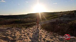 Melody Antunes caresses herself on the beach