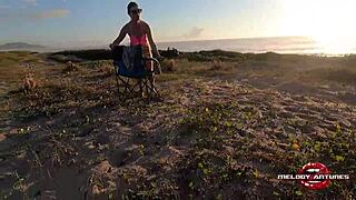 Melody Antunes caresses herself on the beach