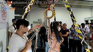 public shibari session exposes my thong and floating tits to the crowd