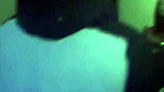 an amateur brunette coed teases and sucks a hard cock at a university party, watched by voyeurs in a group setting.