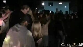 an amateur brunette coed teases and sucks a hard cock at a university party, watched by voyeurs in a group setting.