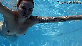 finnish blonde tattooed pornstar mimi dives underwater