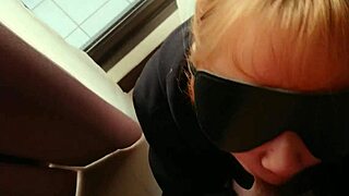 Amateur Nini performs a blowjob beside the window, acting like a bitch