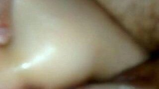 Oiled pussy gets pounded by hard cock in intense session.