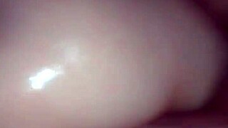 Oiled pussy gets pounded by hard cock in intense session.