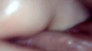 Oiled pussy gets pounded by hard cock in intense session.