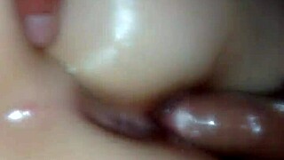 Oiled pussy gets pounded by hard cock in intense session.