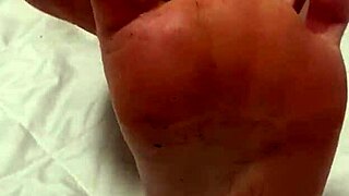Footjob with a vibrator, given by amateur European teen