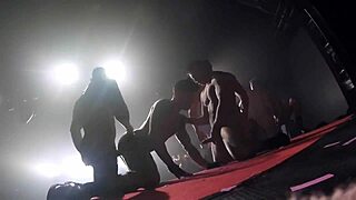 Two gay pornstars dance and get it on at a night club
