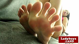 A stunning tattooed ladyboy performs a solo striptease.