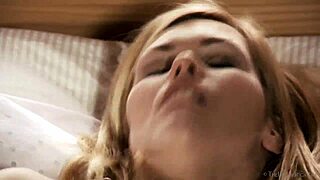 Blonde Delphine fingers her petite tits.