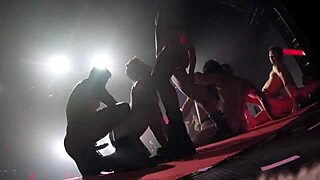 Two gay pornstars dance and get it on at a night club