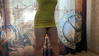 stepmother poses in yellow dress on webcam
