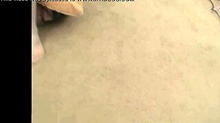 in the kitchen, this brunette babe toys her pussy with a dildo while wearing stockings.