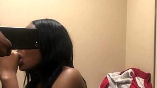 Watch me suck his big black cock in the changing room