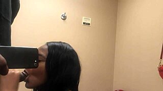 Watch me suck his big black cock in the changing room