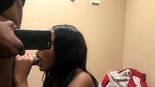 Watch me suck his big black cock in the changing room