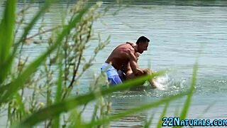 blonde babe performs blowjob on beach