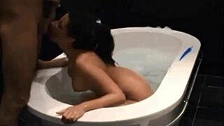 Stunning dark haired vixen blows and bangs in bathtub