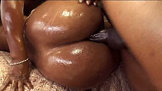 Big black cock interacts with chocolate figures in a neutral setting