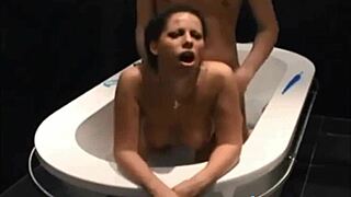 Stunning dark haired vixen blows and bangs in bathtub