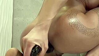 Muscular Blonde Teases Her Anal Dildo In Shower