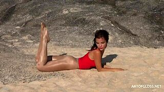 monika wears shiny pantyhose on the beach