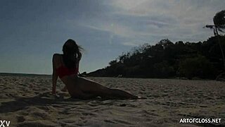 monika wears shiny pantyhose on the beach