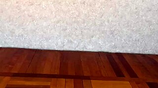 stripping naked and jerking off her shaved pussy