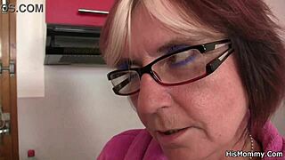 Older European woman is pleasured orally and with toys by a young blonde girlfriend of a man in the kitchen